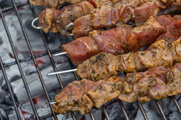 Brochette pork steak on live coal barbecue grill