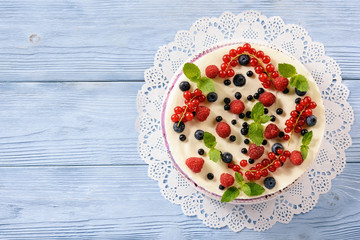 Berry cheesecake with currants, blueberries and raspberries.