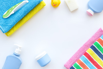 Personal care. Towels, soap and shampoo, cream on white backgrond top view copyspace