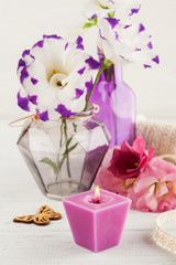 Purple red eustoma flowers on white table