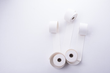 Rolls of paper for old cashier machine on white background