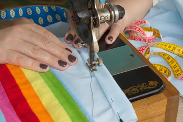 processes of sewing on the sewing machine sew women's hands sewing machine