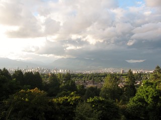 City skyline and mountains panorama on a cloudy day. Vancouver, BC