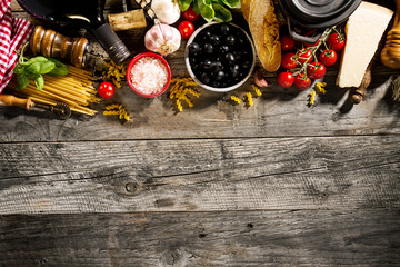 Tasty fresh appetizing italian food ingredients on old rustic wooden background. Ready to cook....