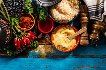 Beautiful Tasty Appetizing Ingredients Spices Grocery for Cooking Healthy Kitchen. Blue Old Wooden Background Top View.