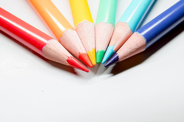 Close up of colorful art drawing pencils on white