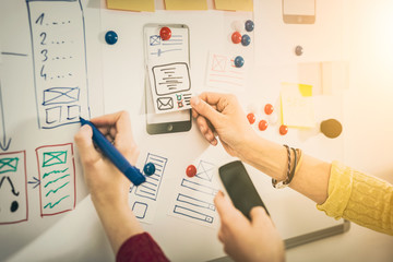 Designer drawing website ux app development.
