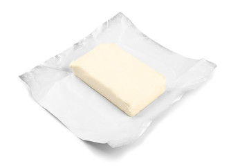 Wrapping with piece of butter on white background