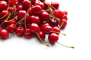 Obraz na płótnie Canvas Heap of sweet cherries on white background