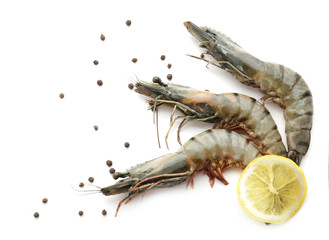 Fresh shrimps with lemon on white background