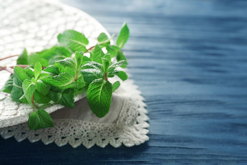 Plate with lemon balm on table