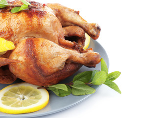Plate with tasty homemade lemon chicken on white background