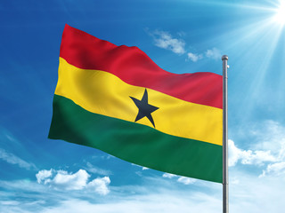 Ghana flag waving in the blue sky
