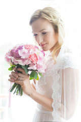 Beautiful bride outdoors in a forest.