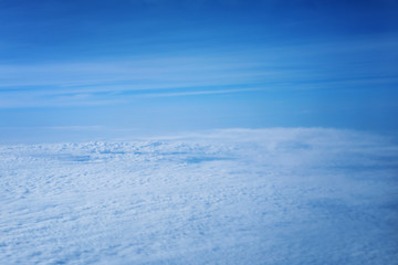 View from aircraft window on white clouds