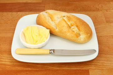 Bread roll butter and knife