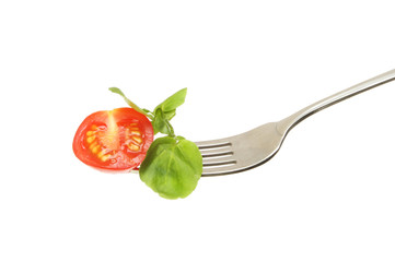Tomato and watercress on a fork