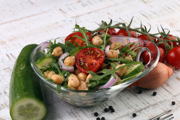 Healthy homemade chickpea and veggies salad, arugula, diet, vegetarian, vegan food, vitamin snack