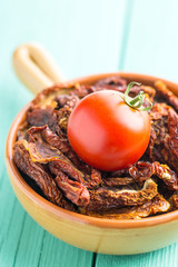 Dried sliced tomatoes and fresh tomatoes.