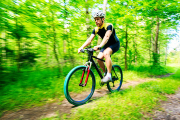 Young Man Riding His Mountain Bike