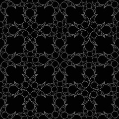 white crescent moons seamless pattern on a black background. Abstract vector art.