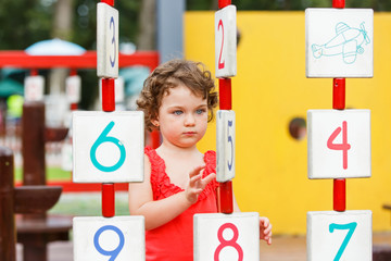 Little girl playing on the playground