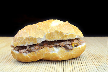Brazilian meat sub isolated on black