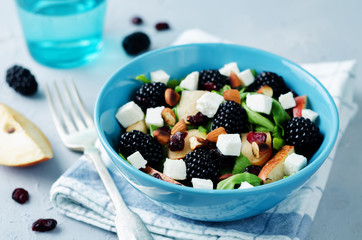 Pear arugula blackberry almond goat cheese dried cranberry salad