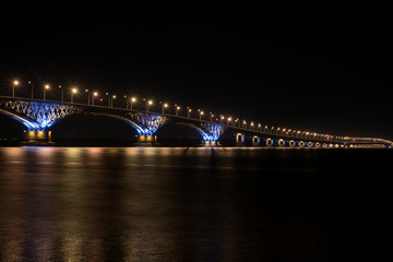 The bridge in night in light of lamps between the cities of Saratov and Engels through the river Volga 