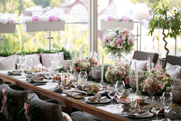 linen textile. Decorated table, a plate of neatly arranged napkin, fork and knife.