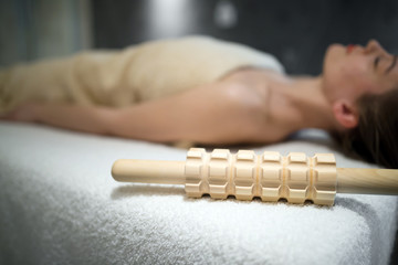 Beautiful woman relaxing on massage bed