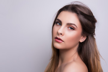 Fototapeta premium Fashionable portrait of a girl model. Fashion, glamour makeup. 