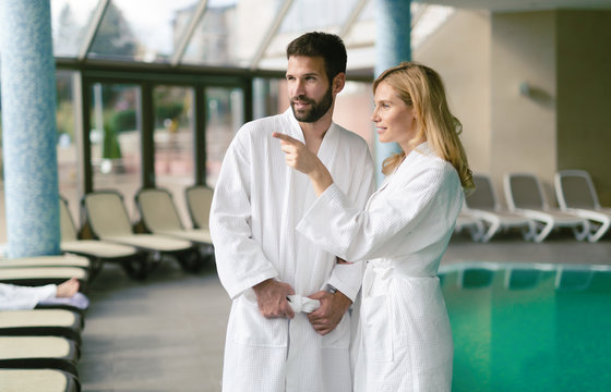 Happy couple relaxing at wellness spa center