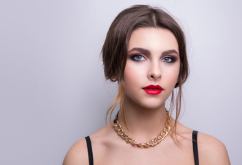 Fashionable portrait of a girl model. Fashion, accessories, evening makeup. 