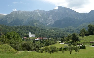 Fototapeta na wymiar panorama with village Drezniske Ravne below the Krn mountain in Julian Alps in Slovenia