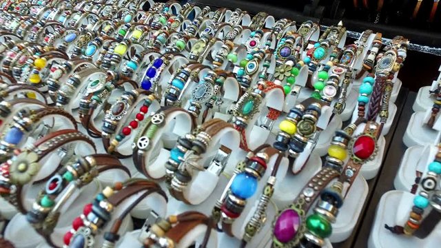 Various colorful leather bracelets on sale at a 