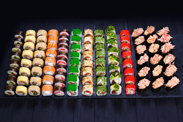 Great assortment of tasty multicolored maki sushi rolls. Sushi menu, restaurant concept