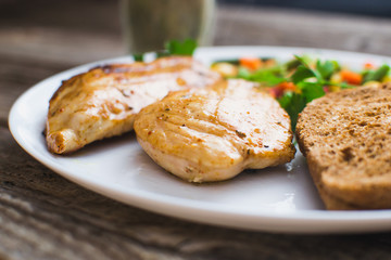Breakfast on the wooden background from chicken breast