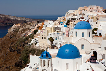 Blue roofs of temples on the island of santorini, village of Oia