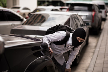 robber in black mask ,robbery concept.