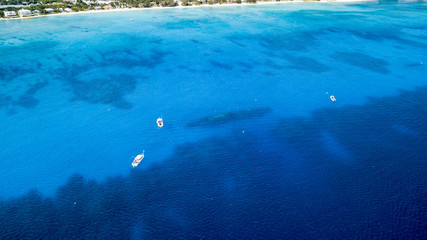Dive boats around the wreck of the USS Kittiwake on Grand Cayman
