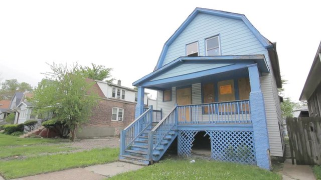 Abandoned and boarded up home
