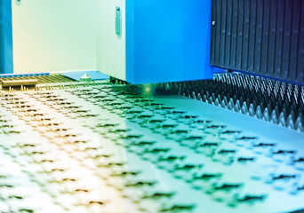 Obraz premium laser CNC cut machine while cutting the sheet metal