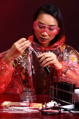 Red Tone Fashion Scientist in Dark room laboratory with tools lab hygiene, blood