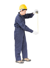 Young worker in unifrom with tape measure on white