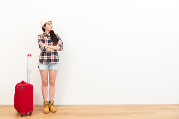 elegant traveler woman standing on wooden floor