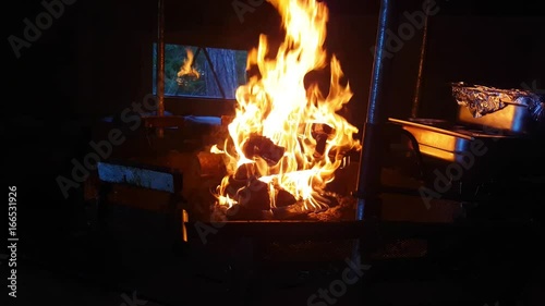 Burning Fire At A Fireplace Inside A Goahti Ready For Dinner