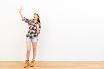 happy female student selfie using her mobile