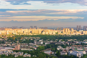 Fototapeta premium Sunbeam on Chengdu city with mountains in the background, China