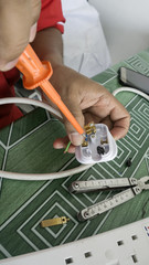 Man Wiring Electrical Plug